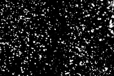 White snow falling down on black background