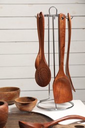 Set of different kitchen utensils on white table