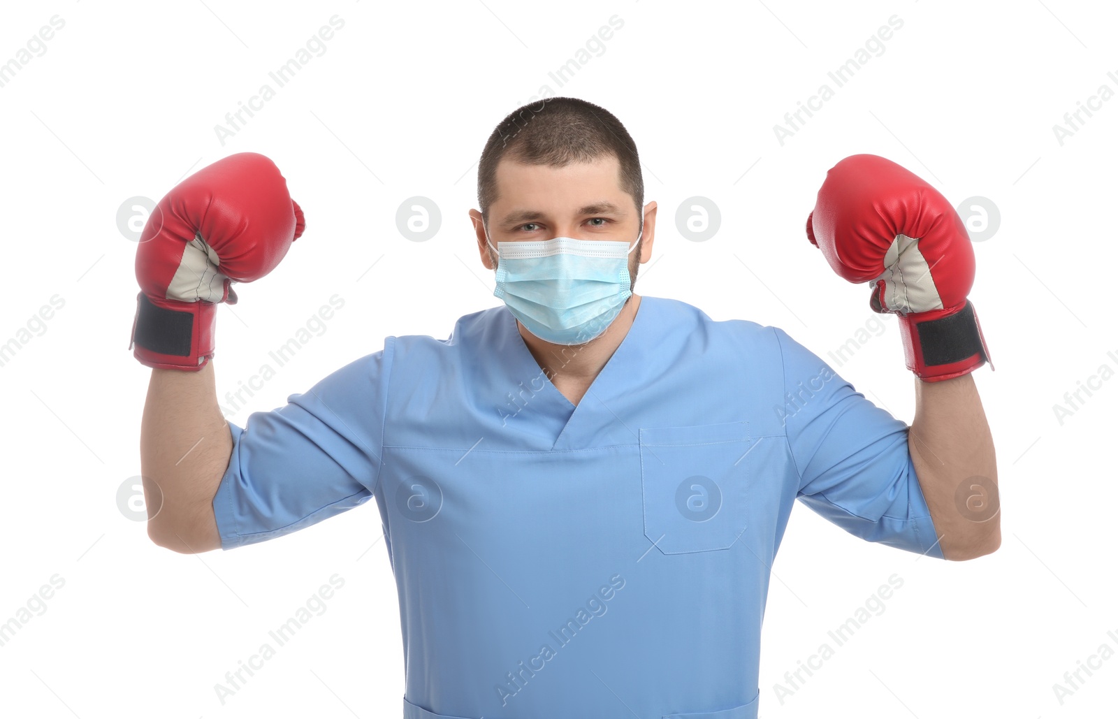 Photo of Doctor with protective mask and boxing gloves on white background. Strong immunity concept