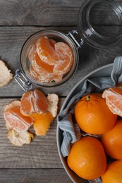 Photo of Many fresh ripe tangerines on wooden table, flat lay