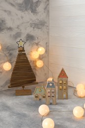 Photo of Christmas decor on table against light background