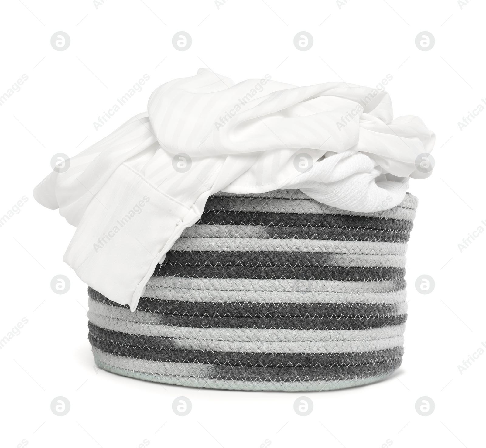 Photo of Laundry basket with clean clothes isolated on white