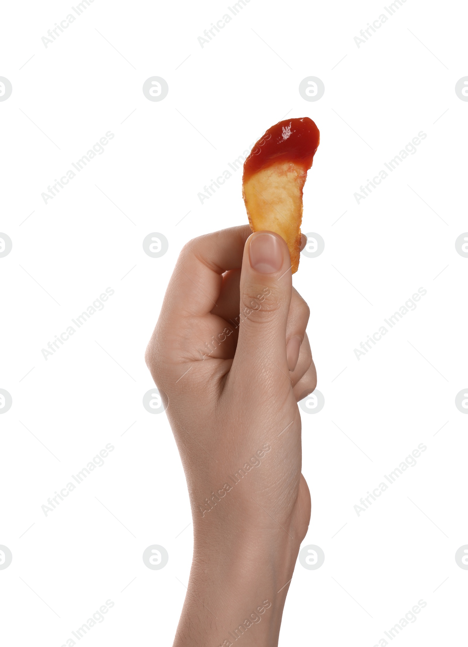 Photo of Woman holding delicious baked potato wedge with ketchup on white background, closeup