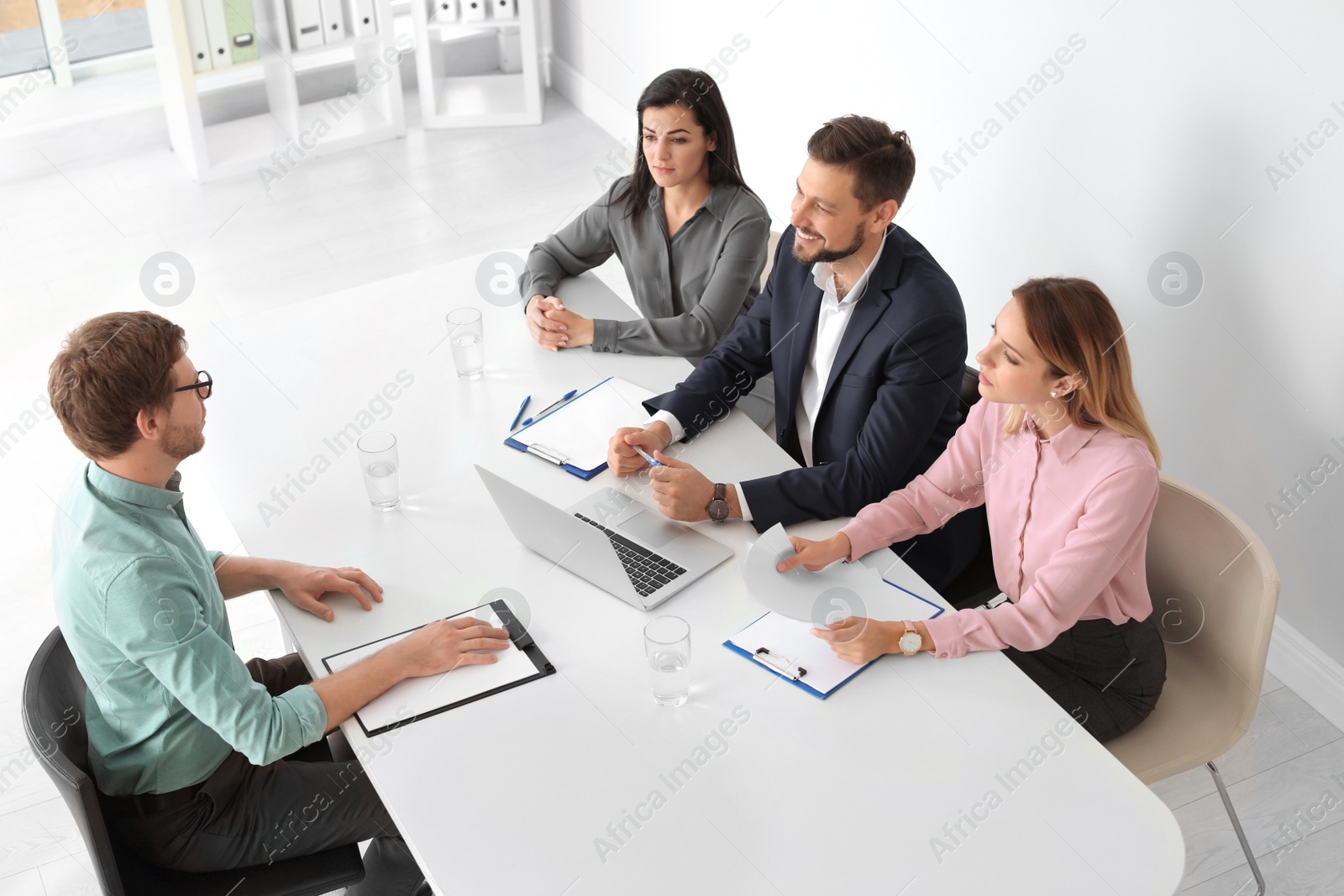 Photo of Human resources commission conducting job interview with applicant in office