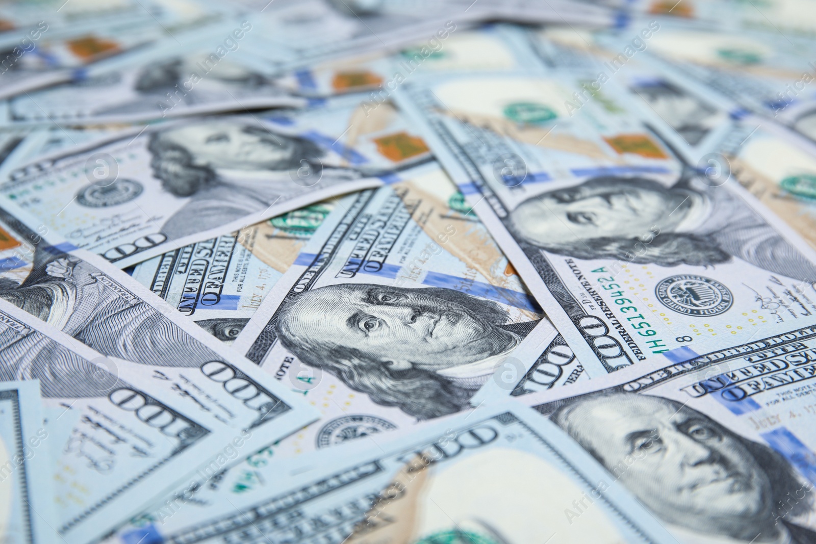 Photo of Many dollar banknotes as background, closeup view