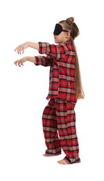 Photo of Girl in pajamas and sleep mask sleepwalking on white background