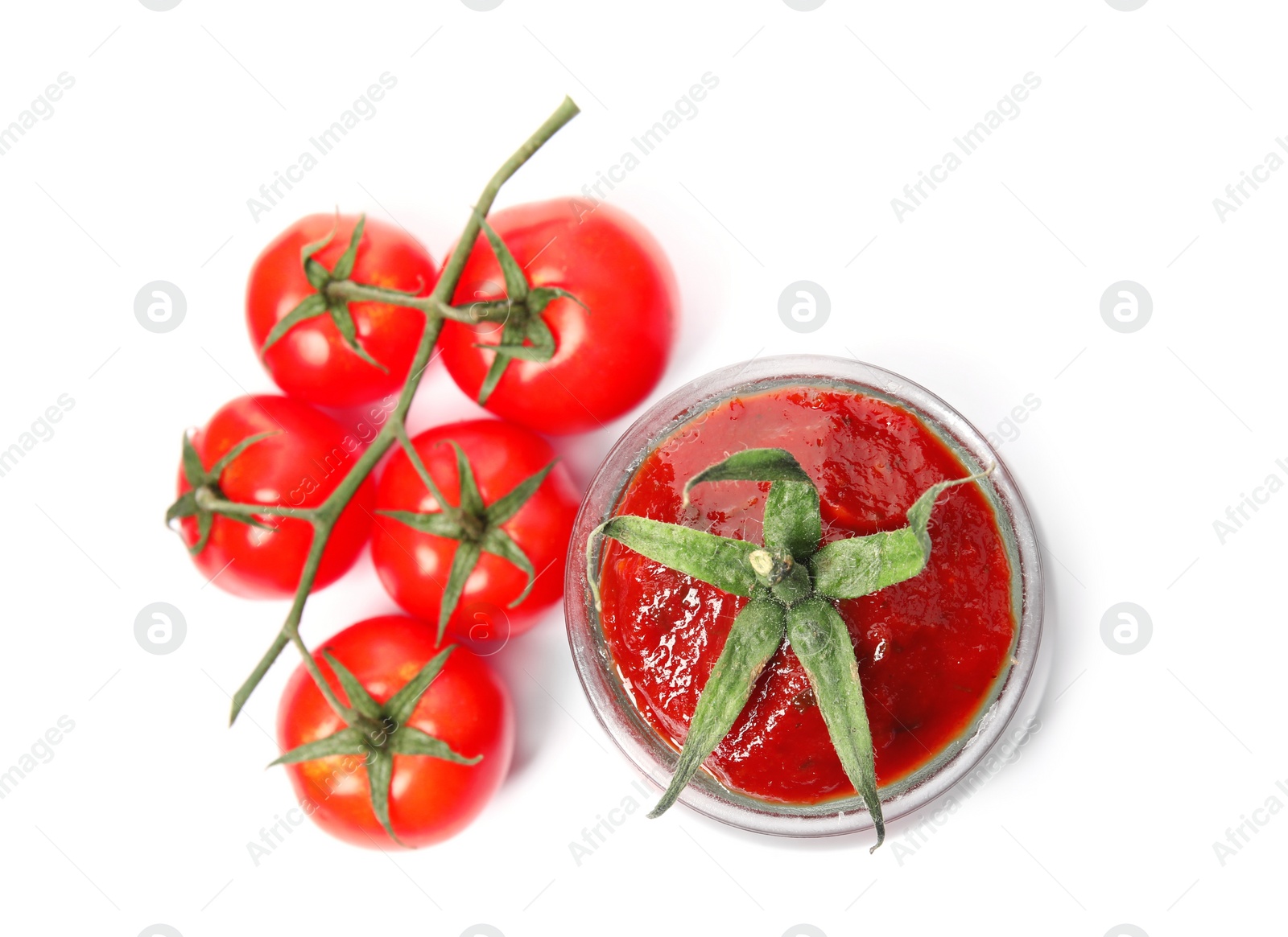 Photo of Tasty homemade tomato sauce in glass jar and fresh vegetables on white background, top view