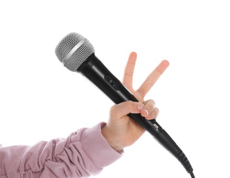 Photo of Child holding microphone on white background, closeup
