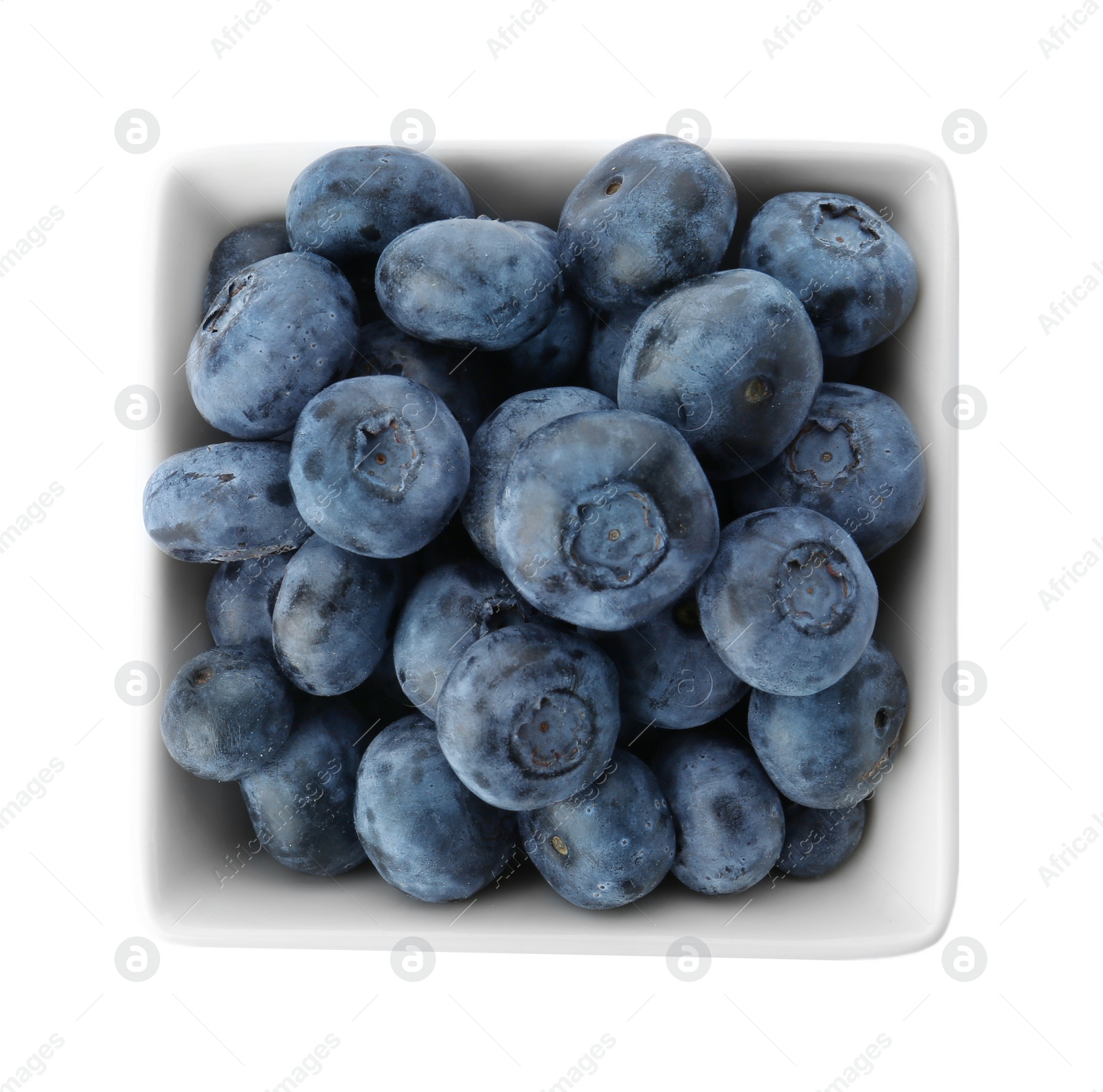 Photo of Bowl full of fresh ripe blueberries on white background, top view