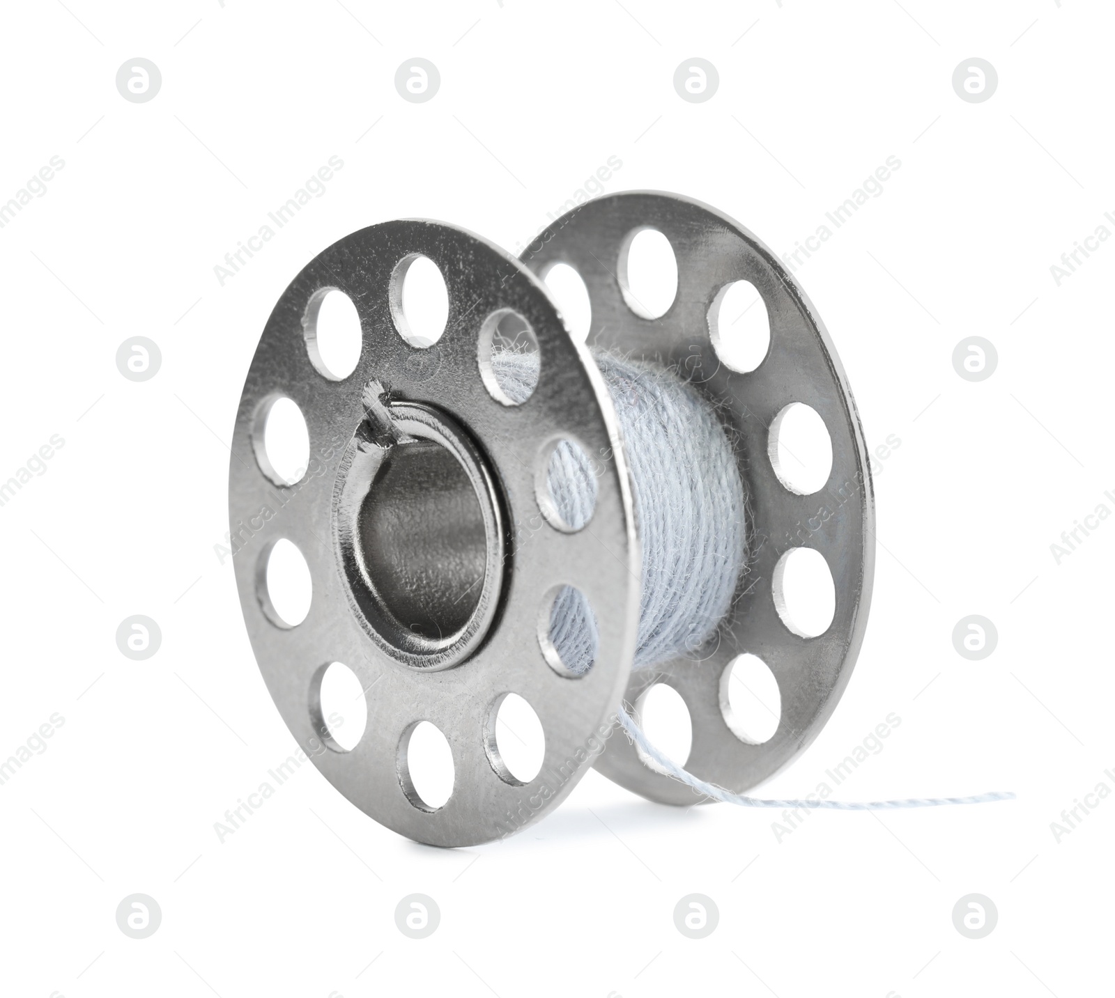 Photo of Metal spool of sewing thread isolated on white