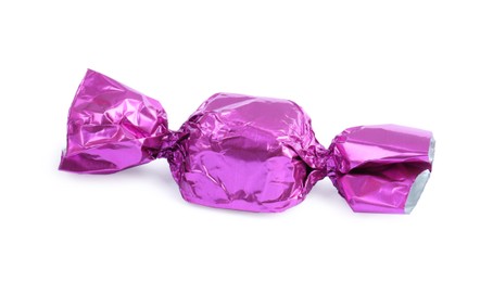 Tasty candy in violet wrapper isolated on white