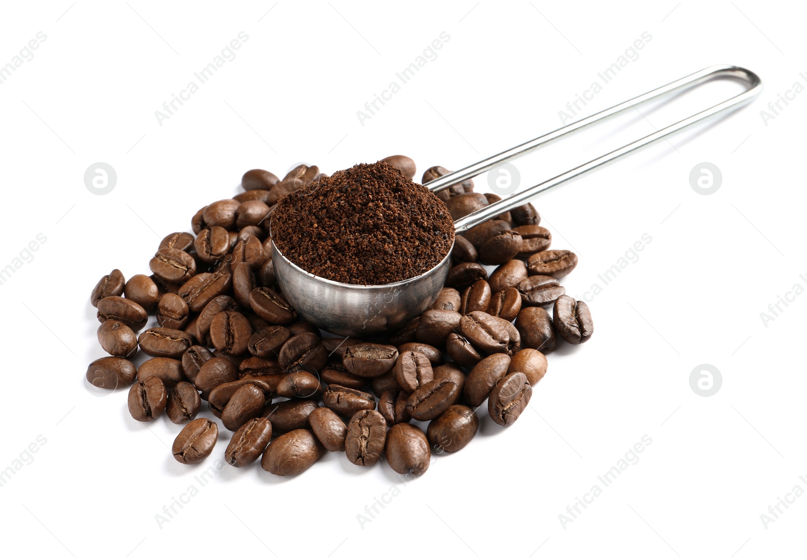 Photo of Scoop with coffee grounds and roasted beans on white background