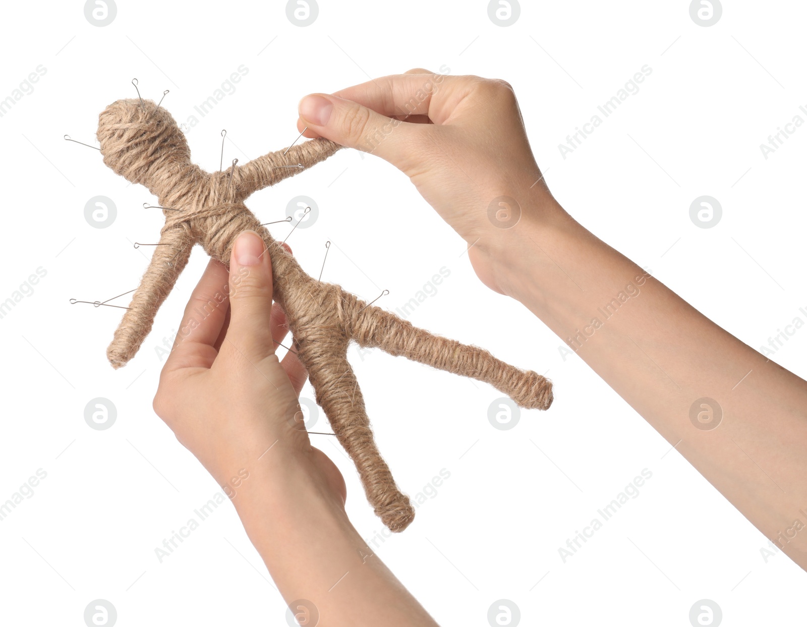 Photo of Woman stabbing voodoo doll with pin on white background, closeup