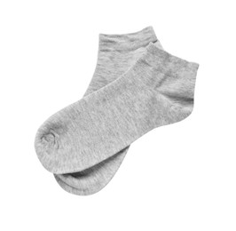 Photo of Pair of grey socks on white background, top view