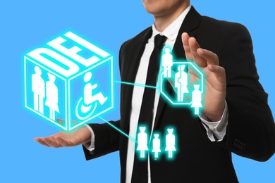 Concept of DEI - Diversity, Equality, Inclusion. Businessman showing virtual image of people and person with disability on turquoise background, closeup
