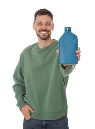 Photo of Man showing blue container of motor oil on white background