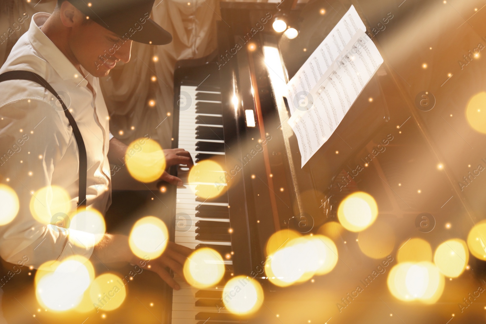 Image of Christmas and New Year music. Man playing piano, bokeh effect