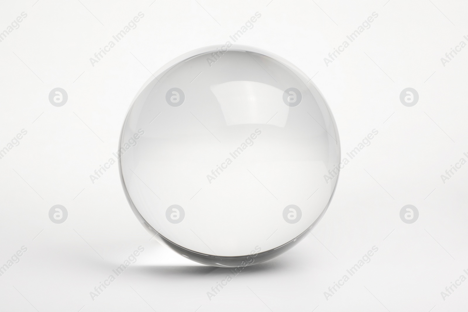 Photo of View of transparent glass ball on white background