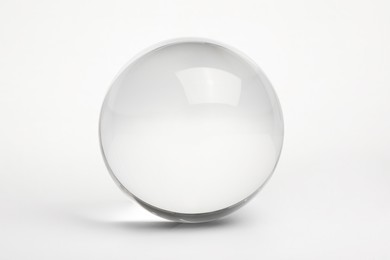 Photo of View of transparent glass ball on white background