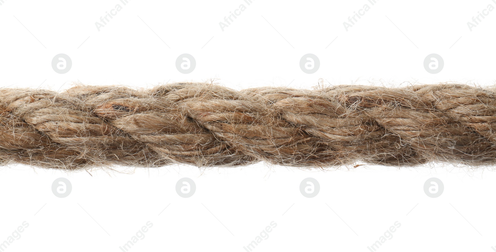 Photo of Hemp rope on white background, closeup. Organic material