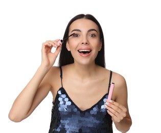 Photo of Beautiful young woman applying mascara on white background