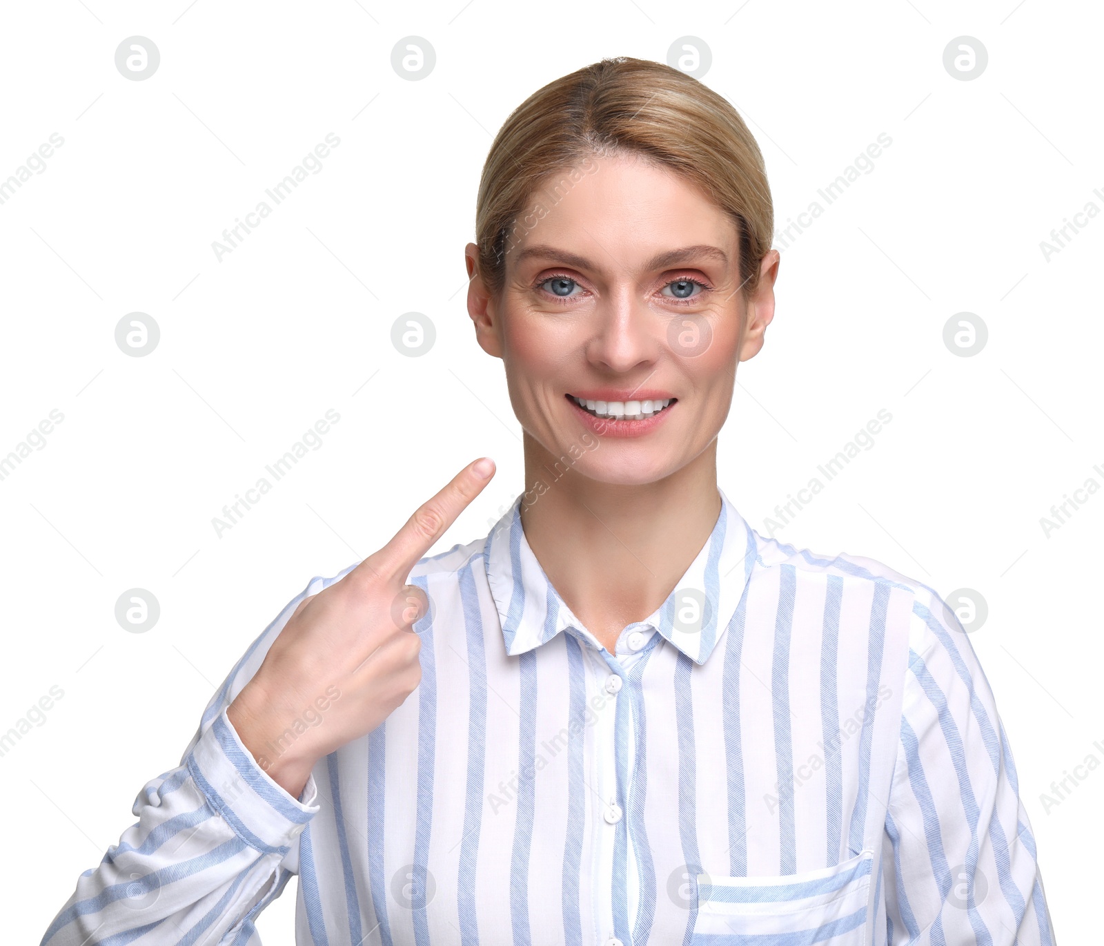 Photo of Woman showing her clean teeth and smiling on white background