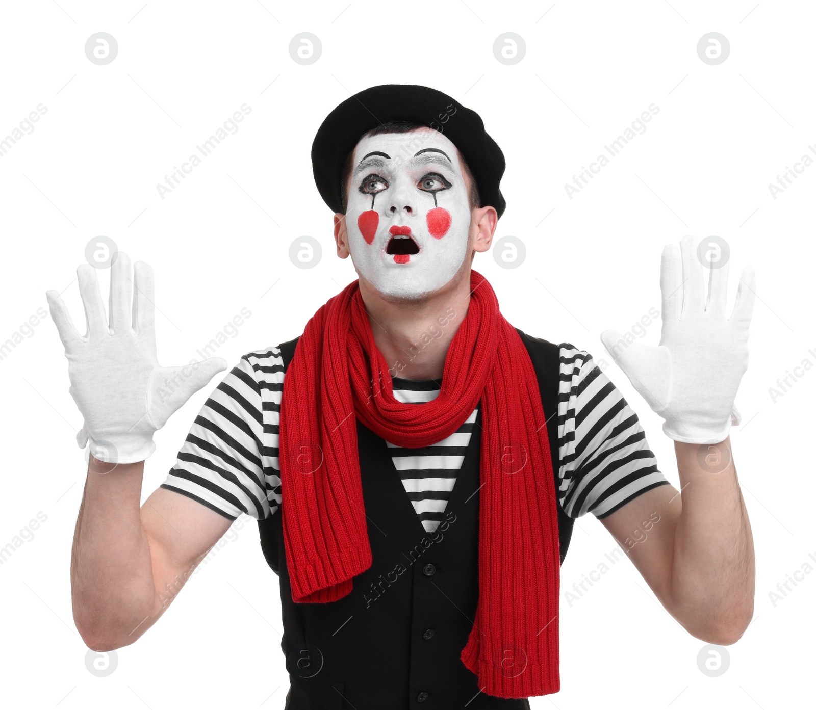 Photo of Mime artist making shocked face on white background