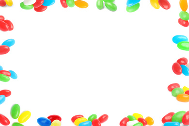Frame of tasty jelly candies on white background