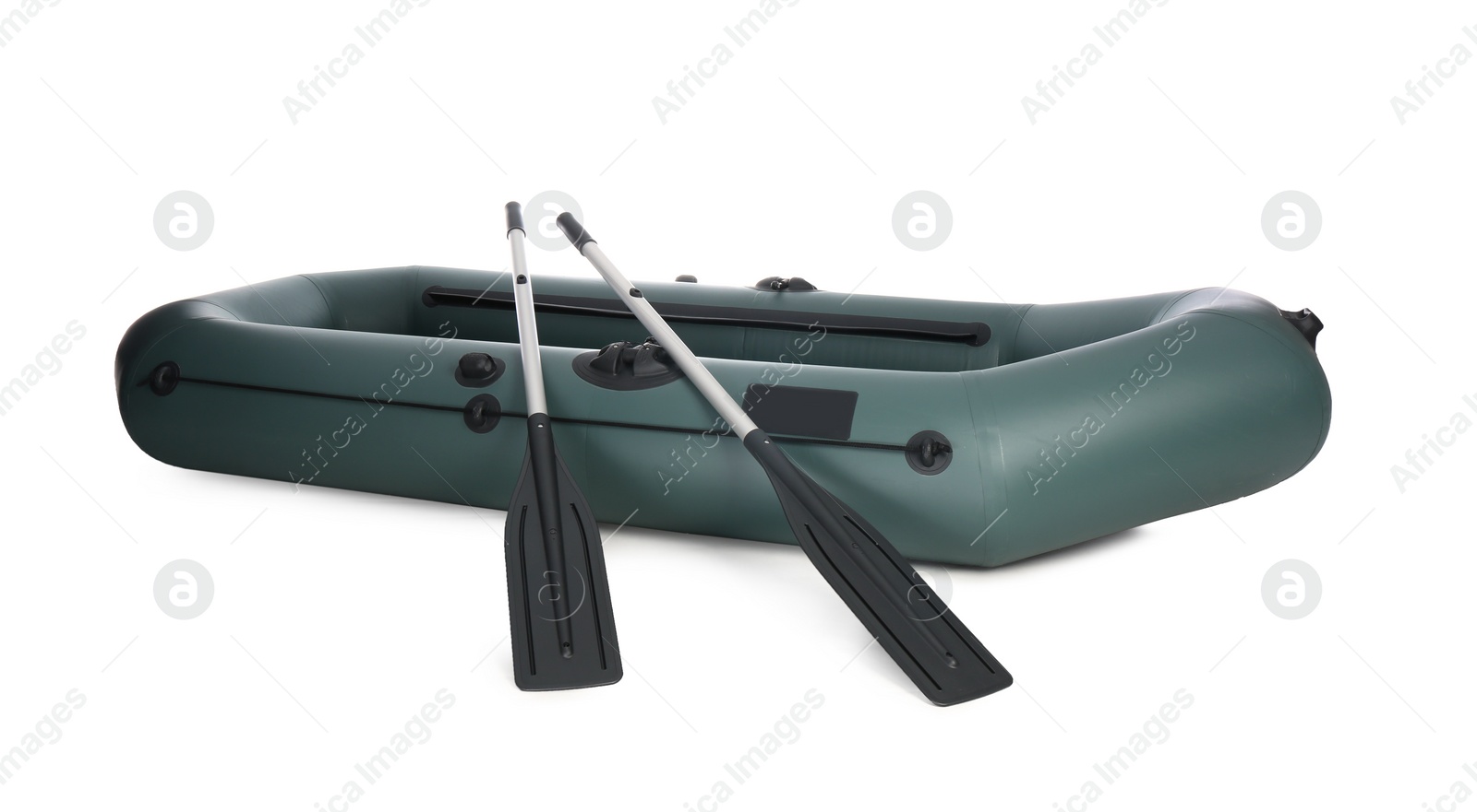 Photo of Inflatable rubber fishing boat with aluminium oars isolated on white