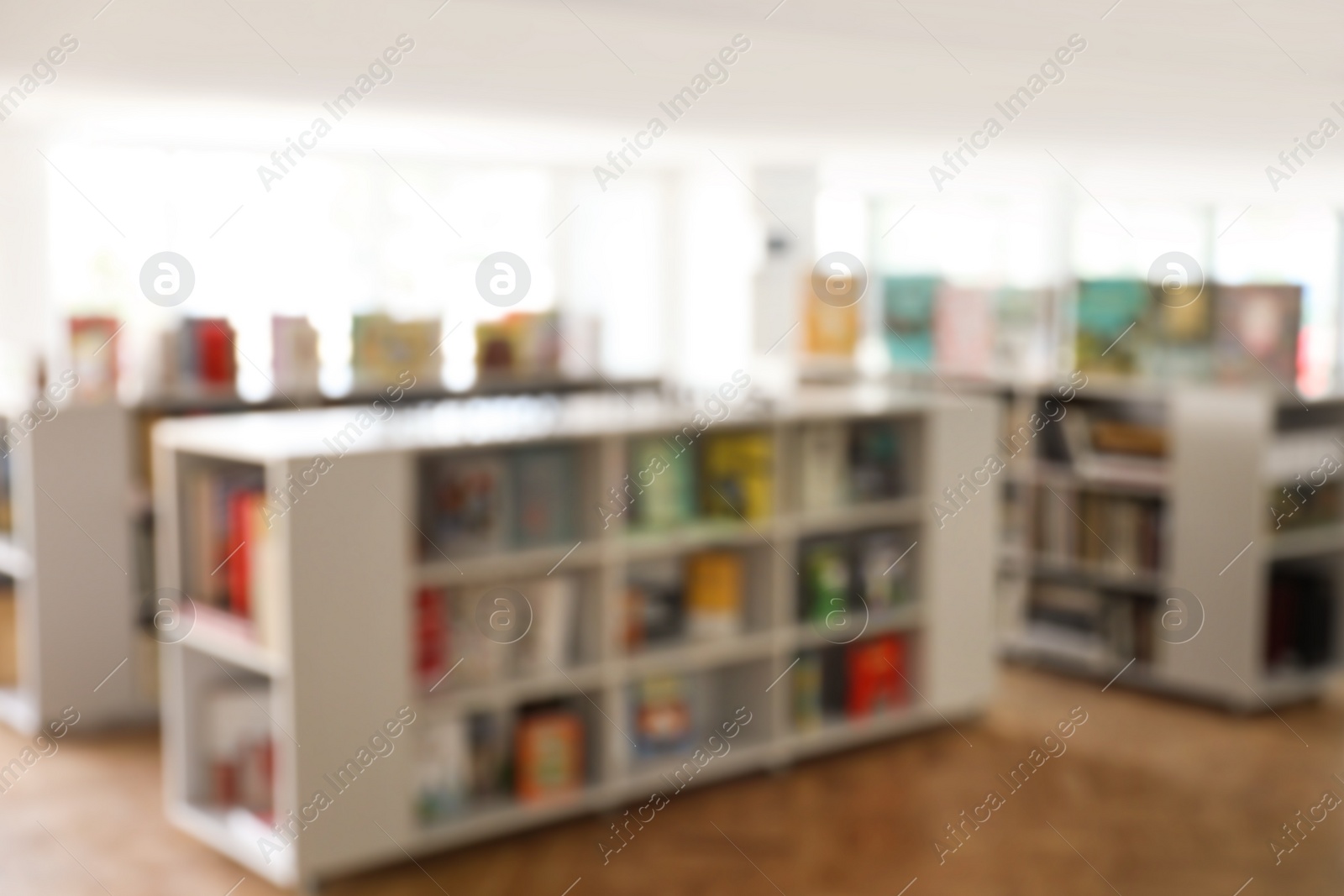 Photo of Blurred view of library interior with bookcases