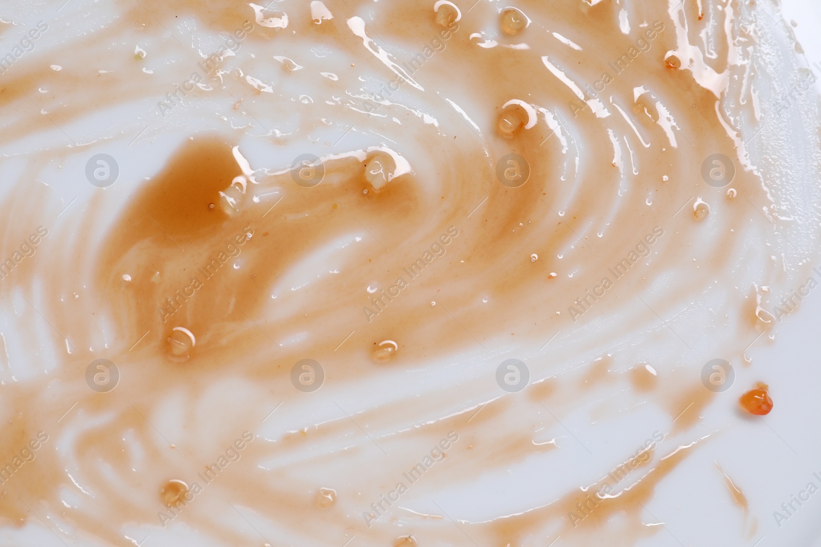 Photo of Smear of sauce on white background, top view