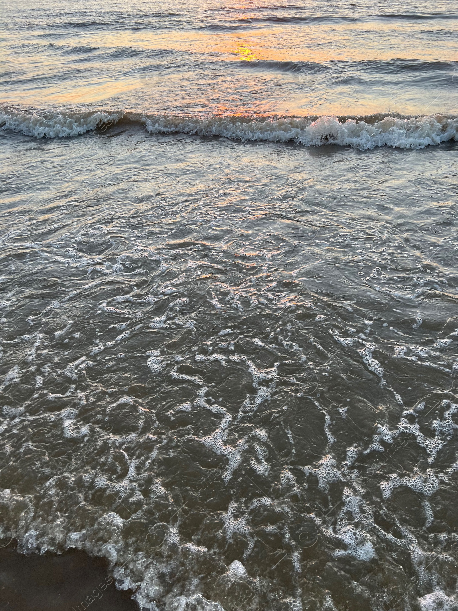 Photo of Beautiful view of sea waves at sunset