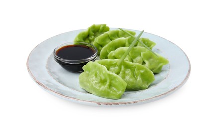 Delicious green dumplings (gyozas) and soy sauce isolated on white