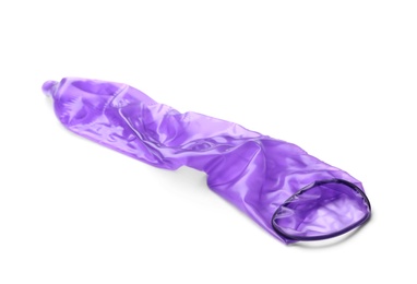 Photo of Purple used condom on white background. Safe sex concept