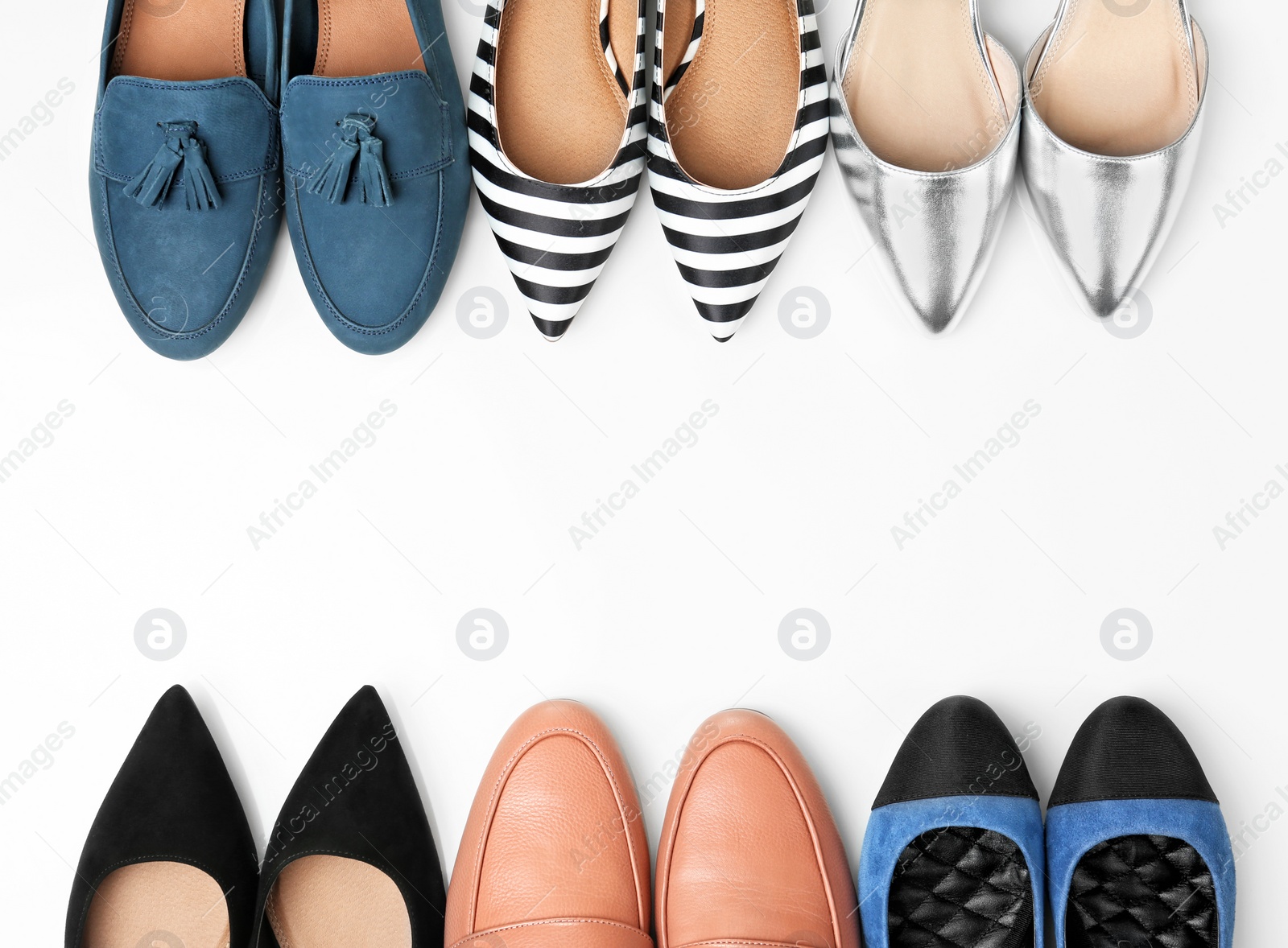 Photo of Different female shoes on white background, top view