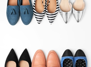 Photo of Different female shoes on white background, top view