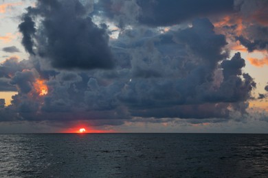 Picturesque view of sky with heavy rainy clouds over sea