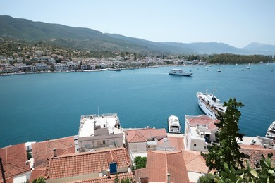 Beautiful view of coastal city with boats on sunny day