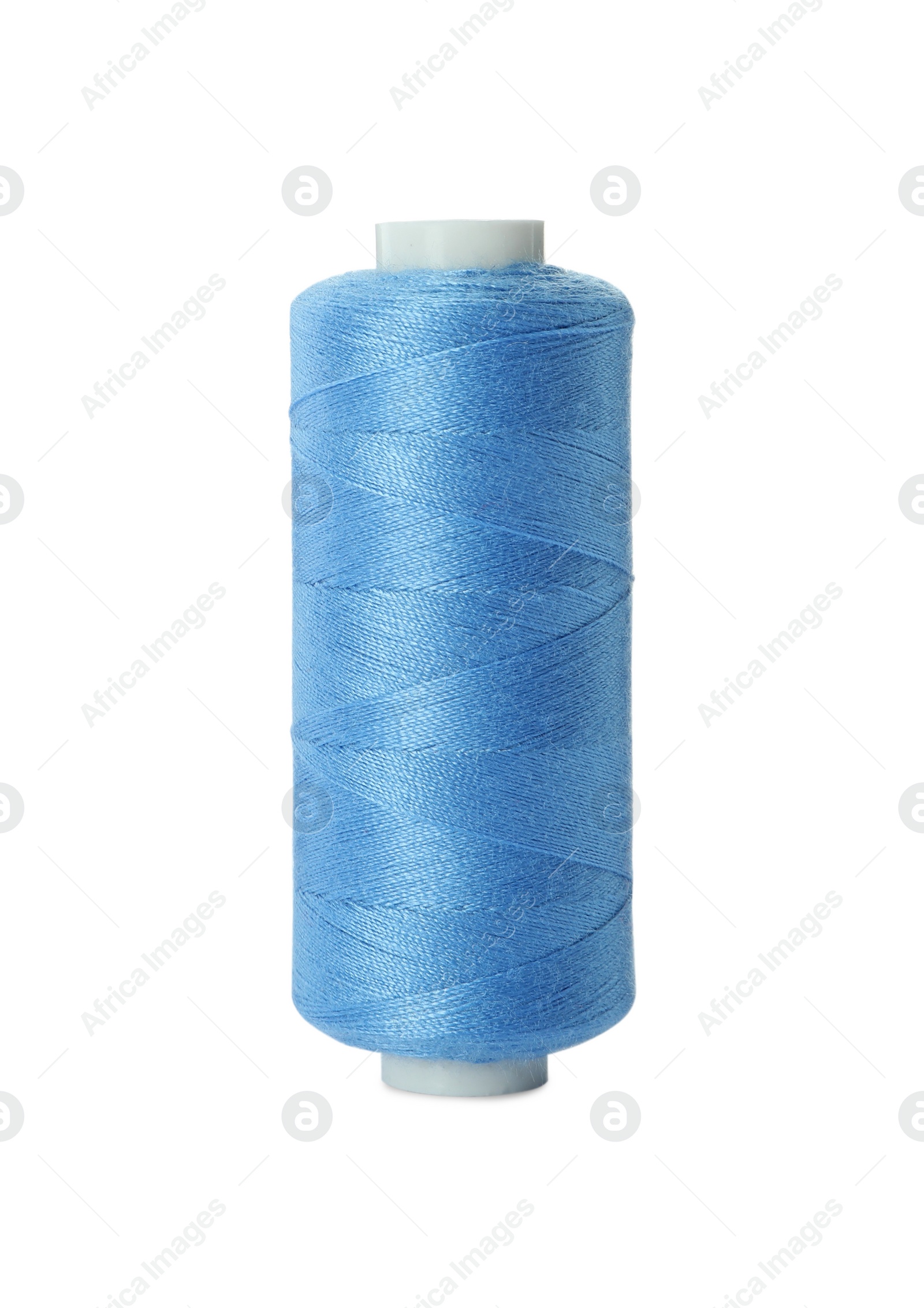 Photo of Spool of light blue sewing thread isolated on white