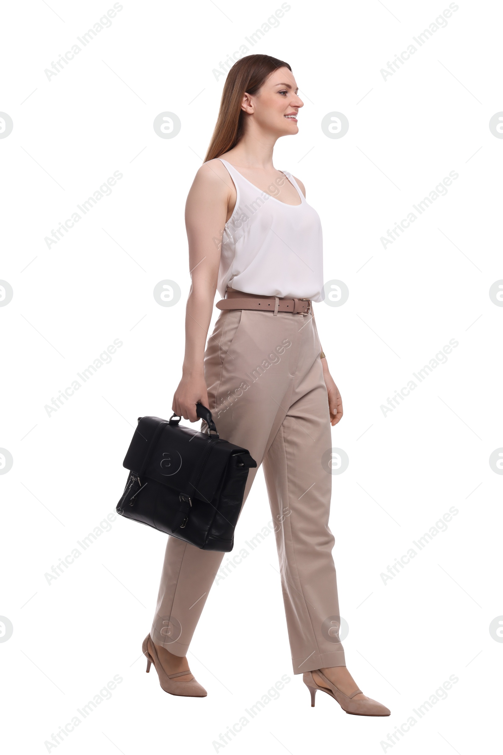 Photo of Beautiful businesswoman in suit with briefcase walking on white background