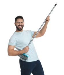 Young man with broom on white background