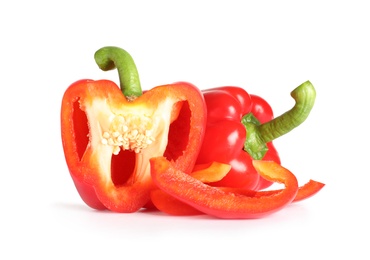 Photo of Cut and whole ripe red bell peppers on white background