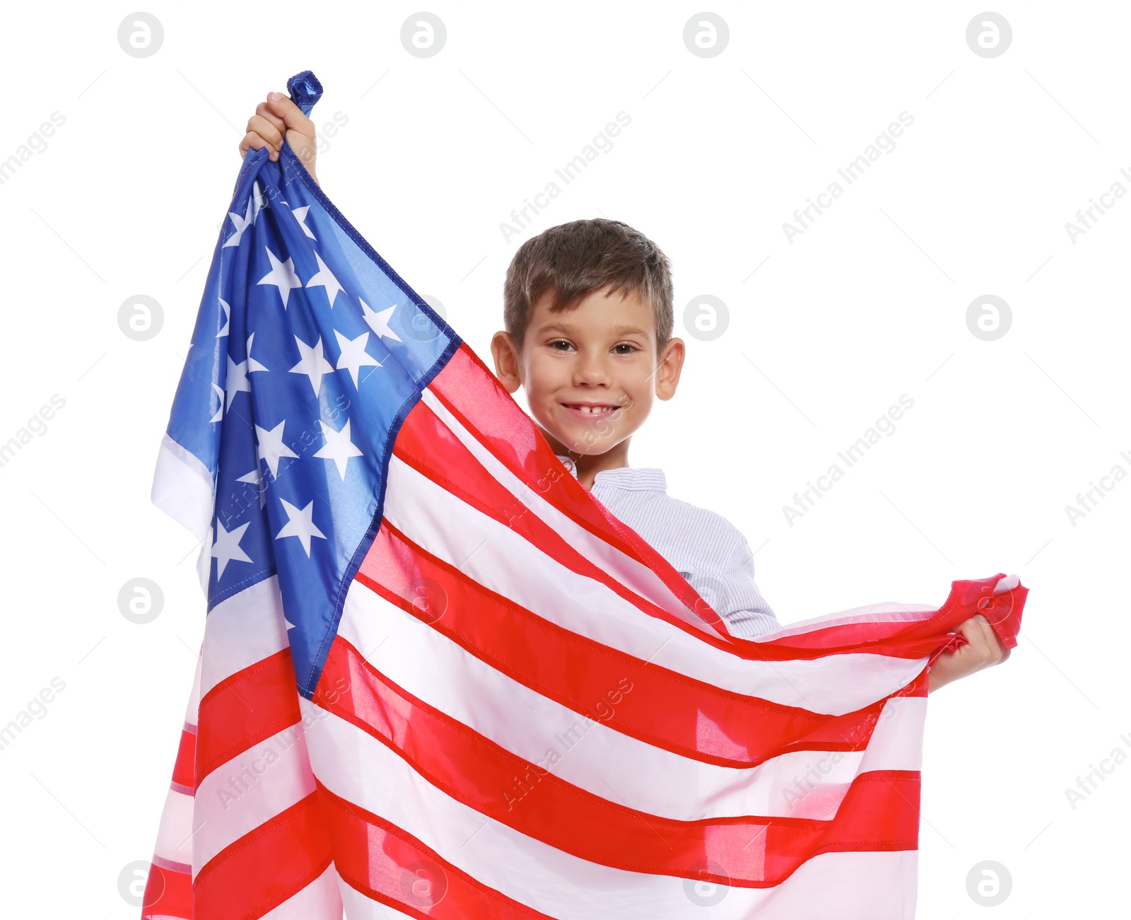 Photo of Portrait of cute little boy with American flag on white background