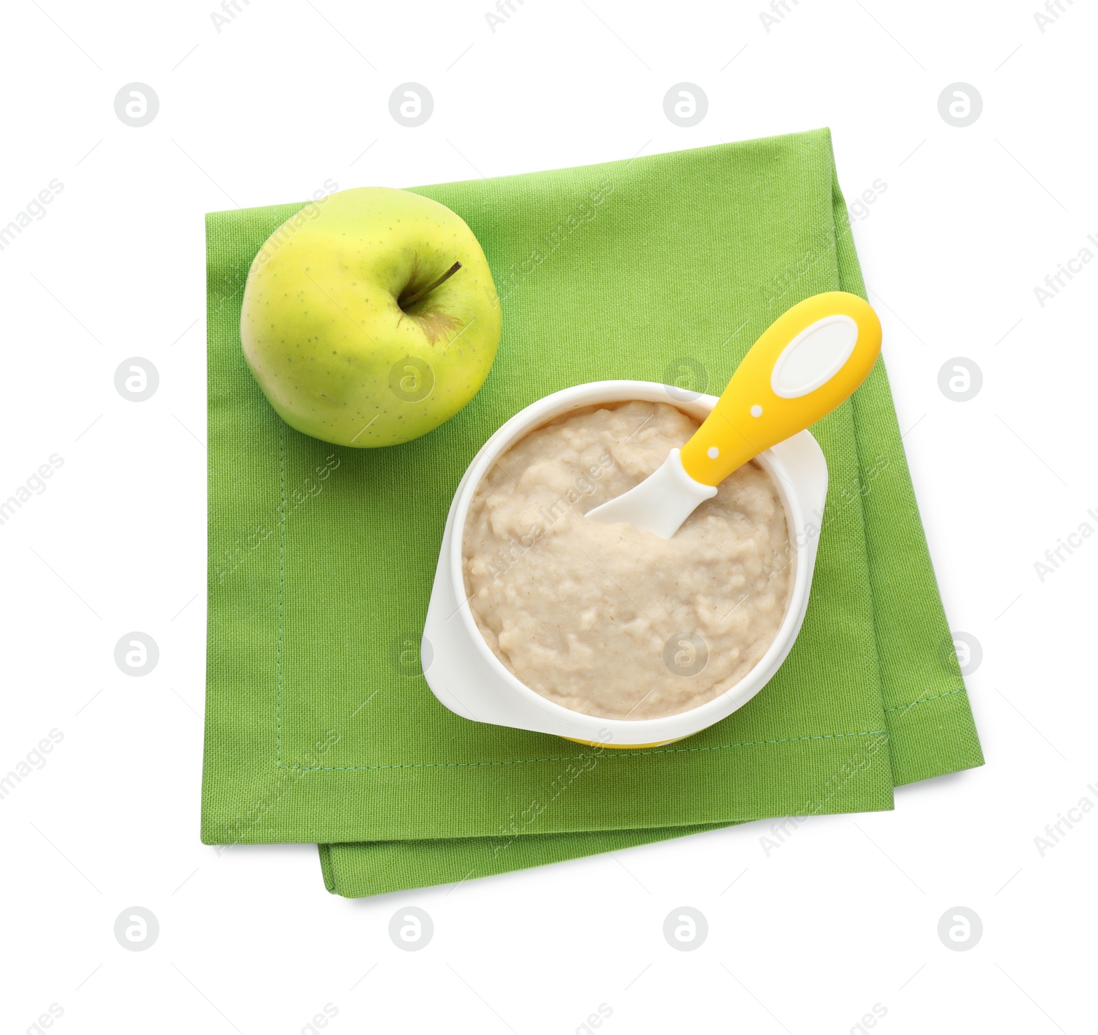 Photo of Plastic dishware with healthy baby food on white background, top view