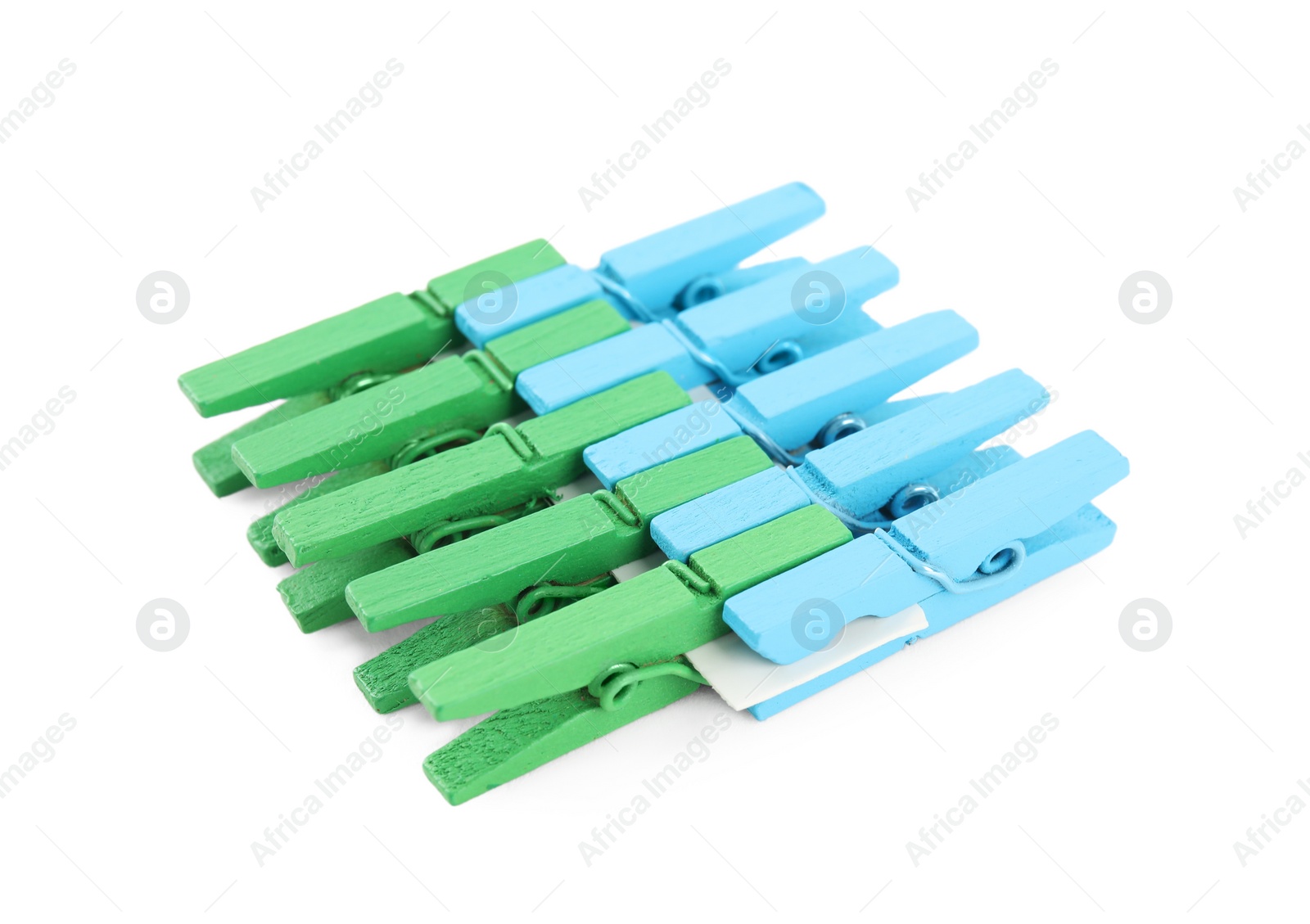 Photo of Set of colorful wooden clothespins on white background