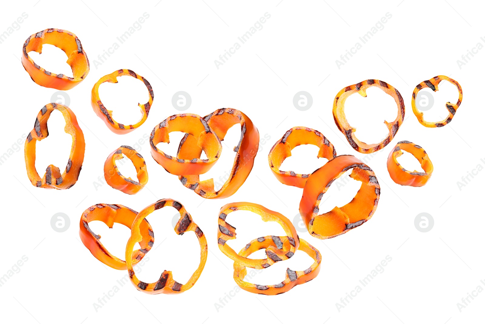 Image of Slices of grilled bell peppers in air on white background