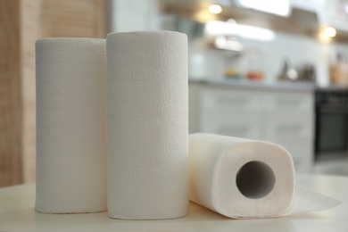 Rolls of paper towels on table in kitchen, closeup