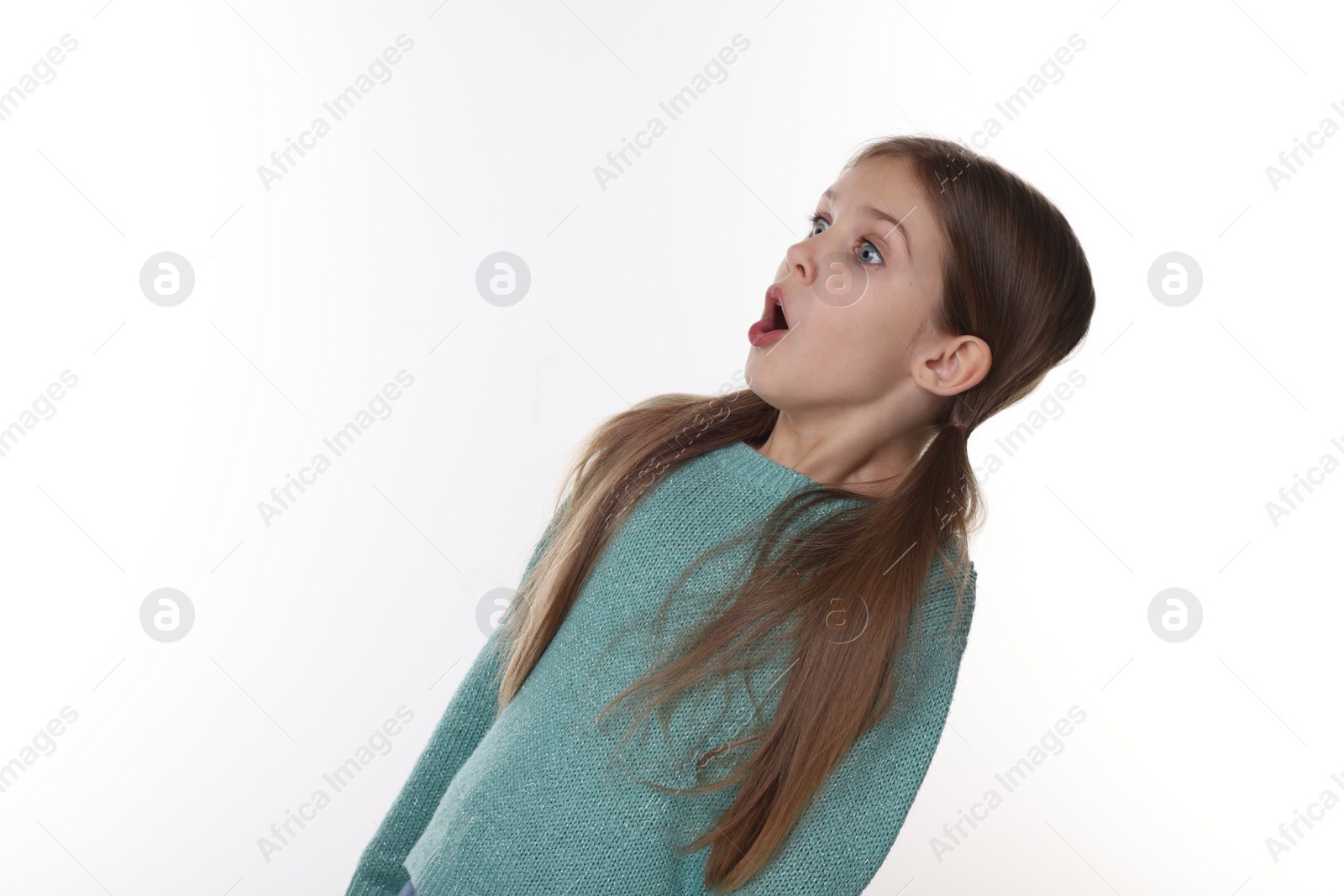 Photo of Portrait of surprised girl on white background