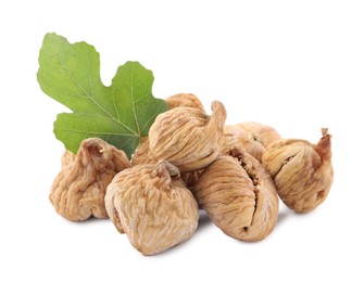 Tasty dried figs and green leaf isolated on white