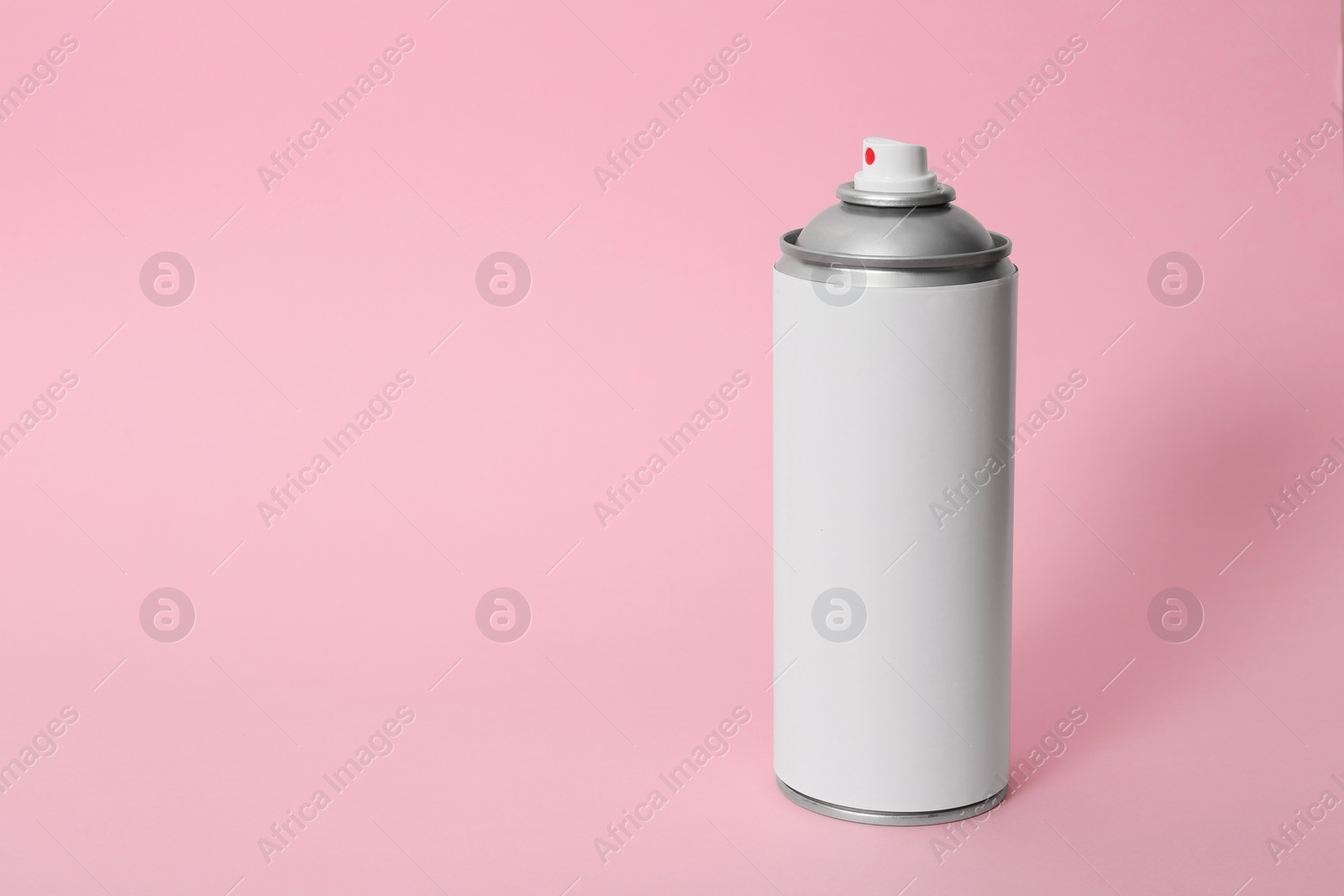 Photo of Can of spray paint on color background. Space for text